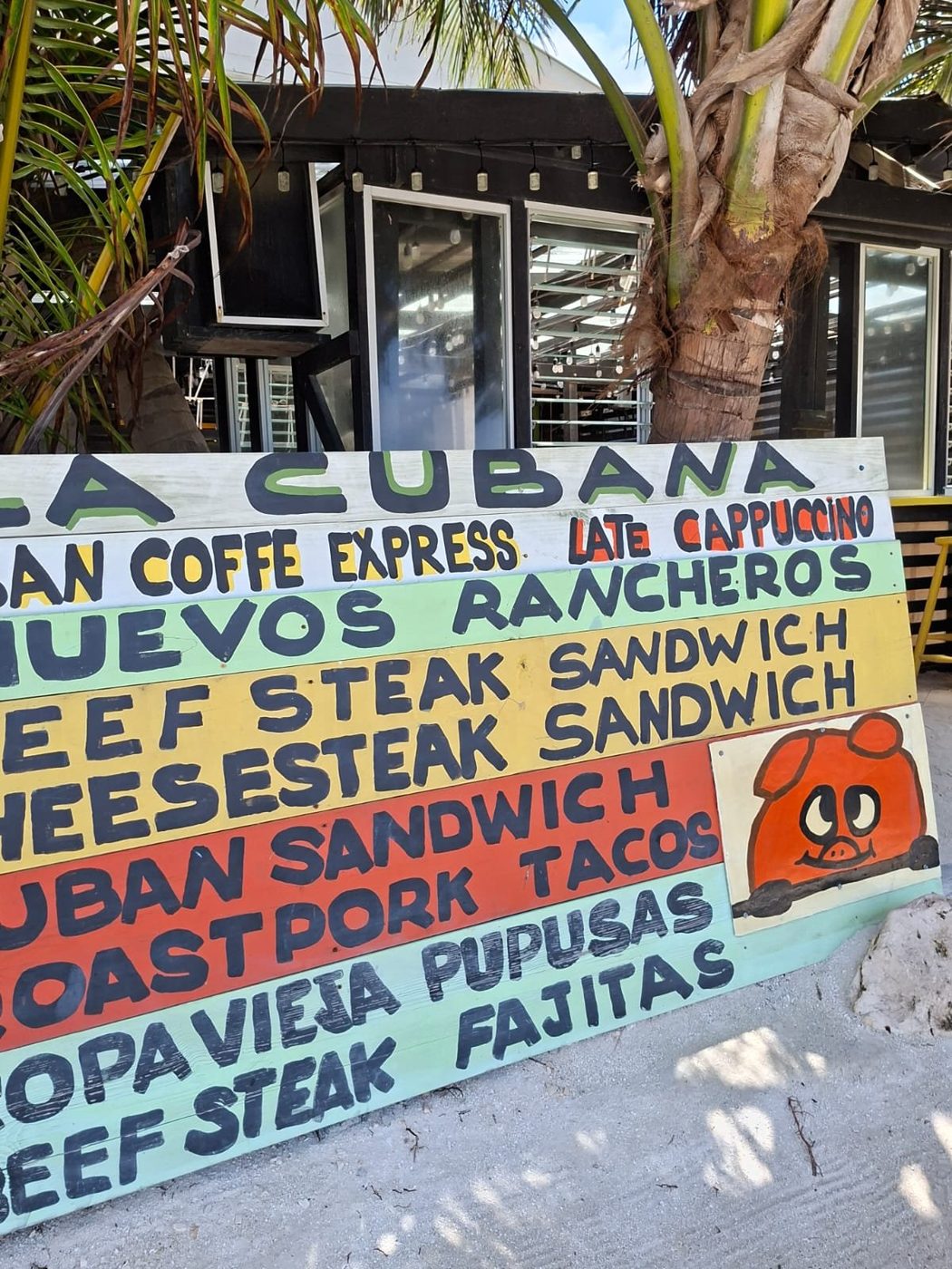 The hand-painted La Cubana menu sign